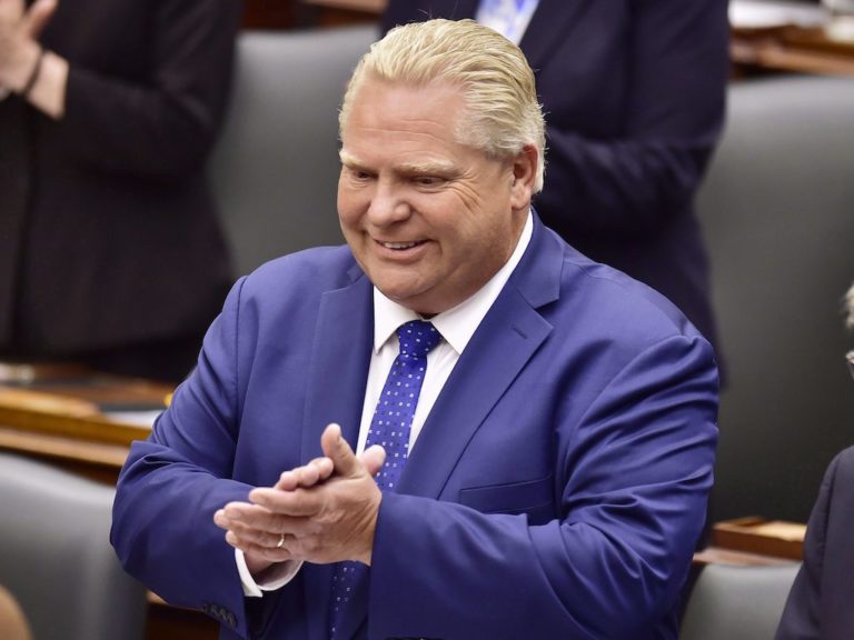 Ontario Premier Doug Ford applauds as Lt.-Gov. Elizabeth Dowdeswell delivers the speech from the throne to open the new legislative session at the Ontario Legislature at Queen's Park in Toronto on Thursday, June 12, 2018.