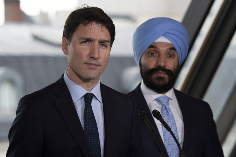 Prime Minister Justin Trudeau and Innovation Minister Navdeep Bains at a summit to discuss stopping the spread of extremist content online in Paris in May 2019