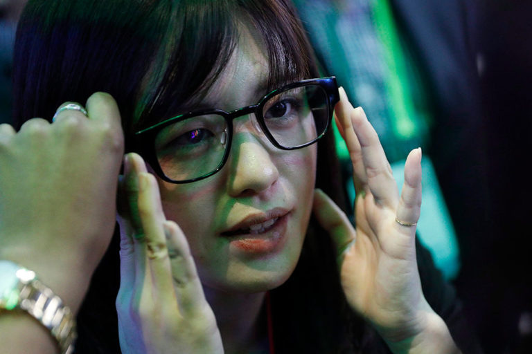 An attendee tries North’s Focals smart glasses at the company’s booth at the CES in Las Vegas in January 2019.