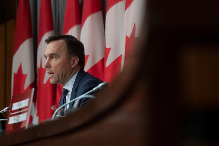Finance Minister Bill Morneau speaks at a press conference in Ottawa in March 2020.