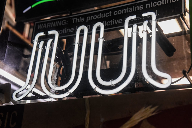 A sign advertising Juul products is displayed in a New York City store in December 2019.