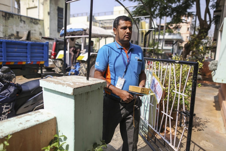 A delivery person for e-commerce platform Flipkart, now owned by Walmart, delivers a package in Bengaluru, India in October 2016.