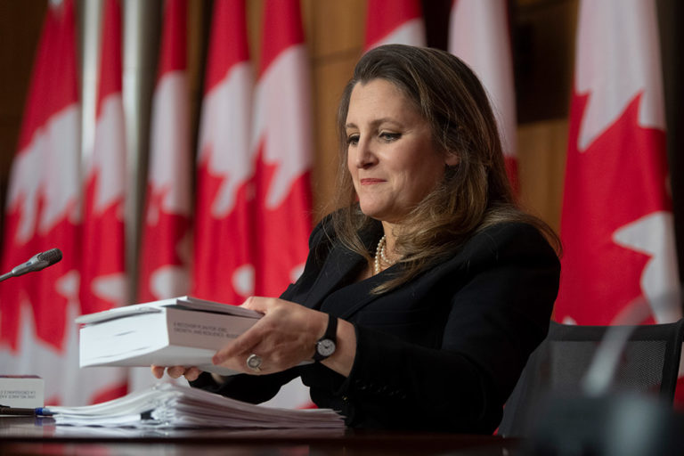Finance Minister Chrystia Freeland holds a copy of the 2021 federal budget during a news conference in Ottawa in April 2021.
