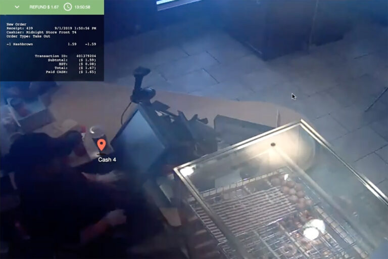 A screenshot from a Solink demonstration video where an employee is found to be stealing from a cash register. (Solink via YouTube)