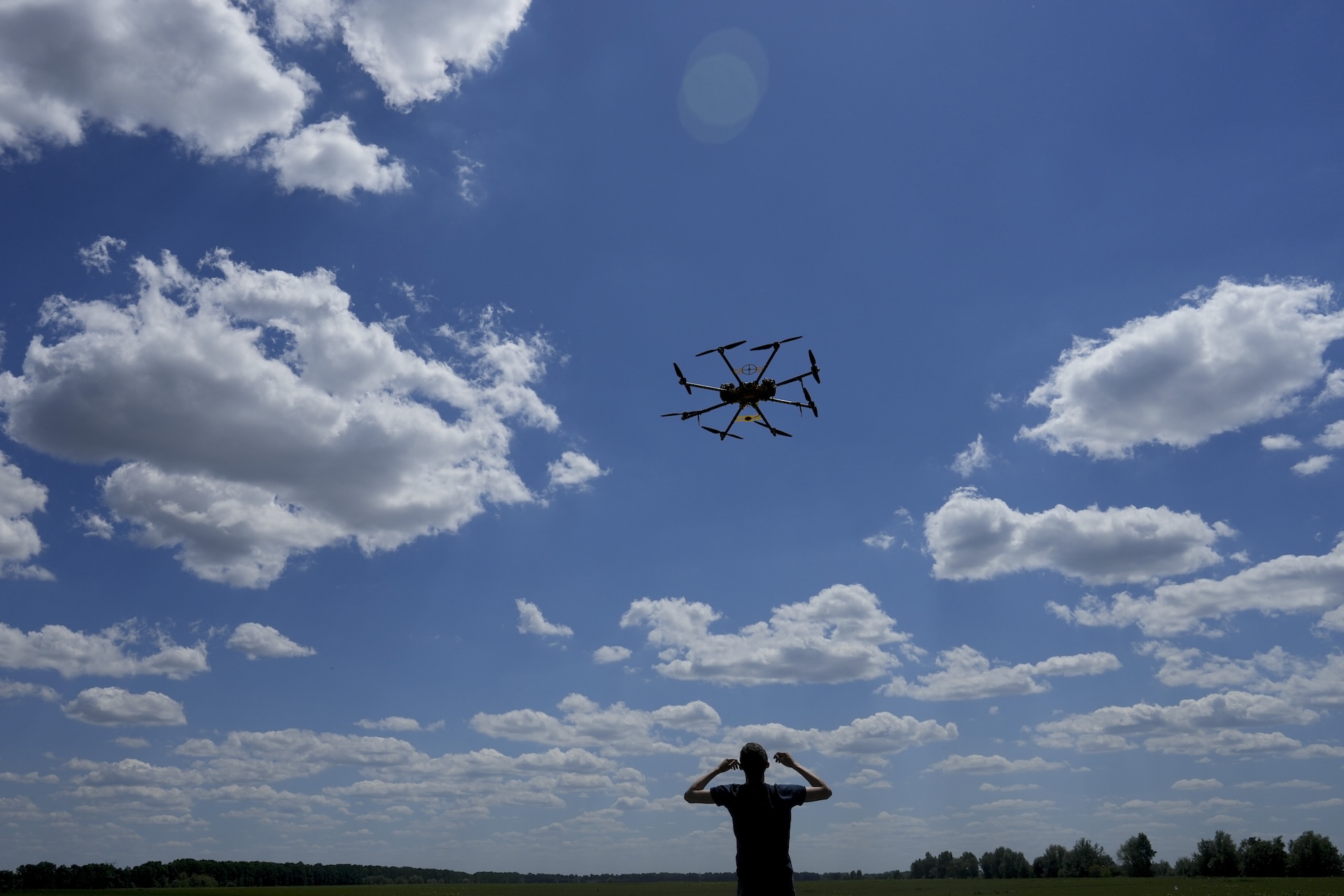 Oleg flies a drone while testing it on the outskirts of Kyiv, Ukraine, in June 2022. Credit: AP Photo/Natacha Pisarenko