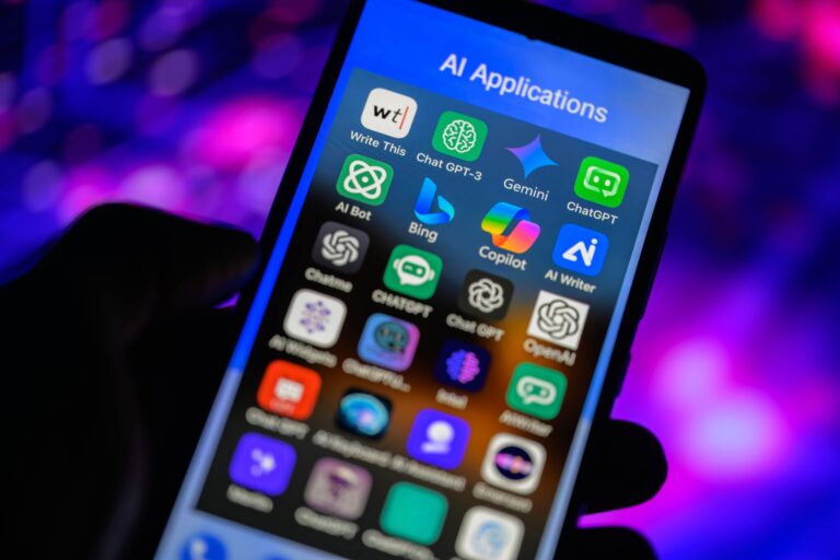 Icons of AI-powered apps, including Bing, Gemini, ChatGPT and Copilot, are displayed on a smartphone in this photo illustration. 