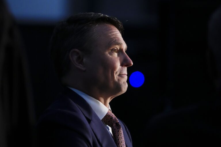 A close up of CPPIB CEO John Graham wearing a suit and tie.