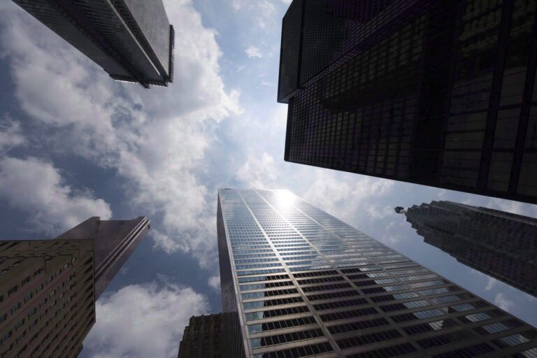 Tall bank towers are shown from Bay Street in Toronto's financial district.