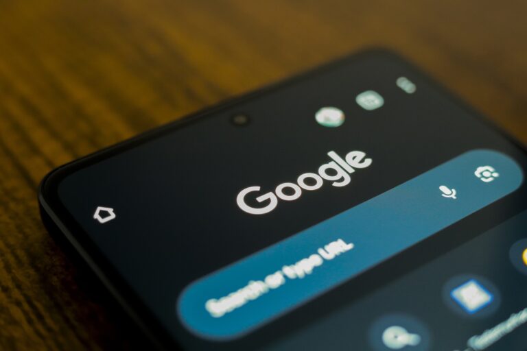 An illustration of a Google News web page, displayed on the screen of a black smartphone.