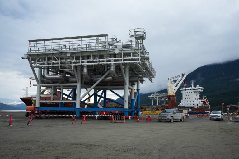A ship carrying a module is seen at the dock of the LNG Canada export terminal, which is under construction.
