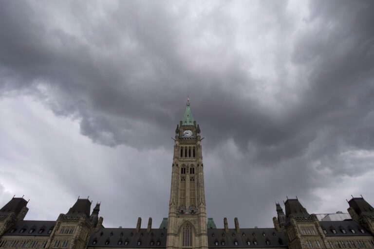 Dark clouds pass by the Parliament buildings in Ottawa.