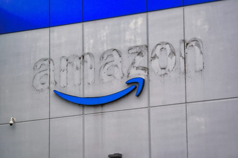 Letters that once spelled Amazon on the side of a warehouse