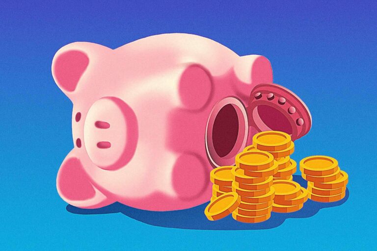 A pink piggy bank lies on its side with its coin slot open and a pile of gold coins spilled out next to it against a blue background.