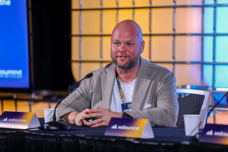 A close-up shot of the CEO of Jack Newton, as he speaks at a panel at Web Summit conference.