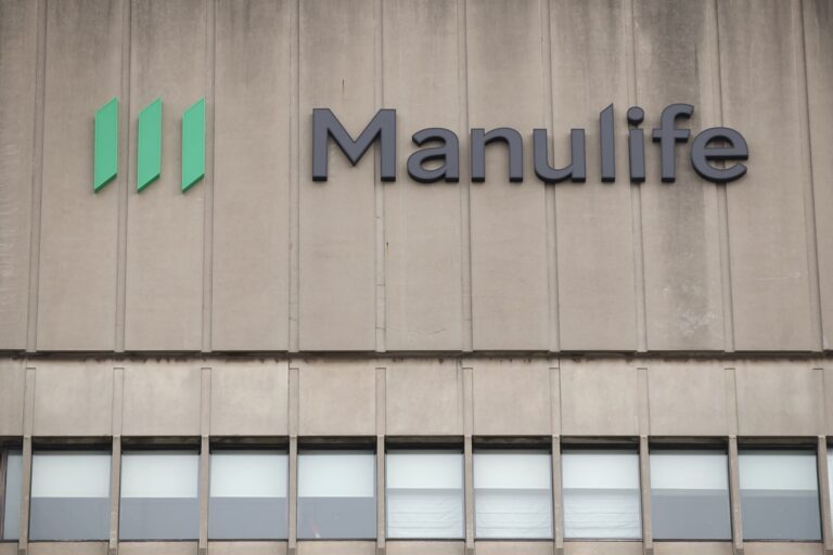 The exterior of a building displays the Manulife logo and name above a row of windows.