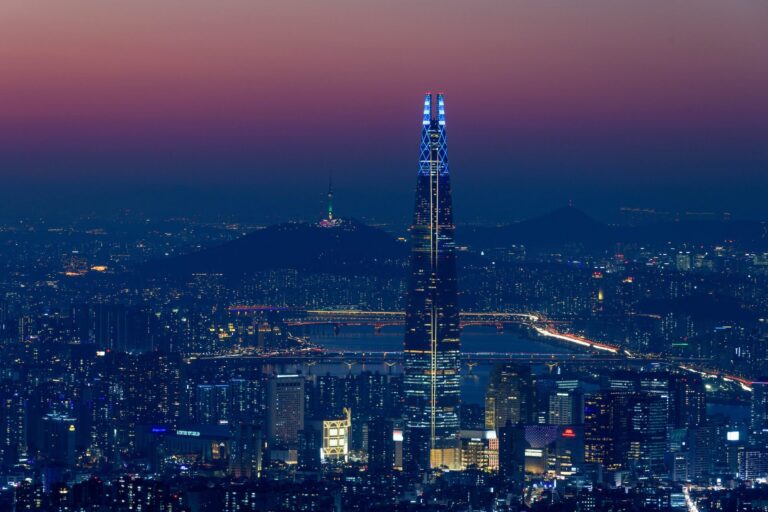Picture of Seoul showing the Hangang River and buildings between the city's iconic tourist attractions, 123-storey skyscraper Lotte Tower and Namsan Tower