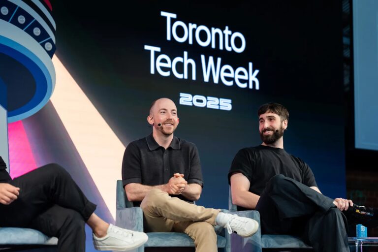 Image of Michael Katchen and Aidan Gomez sitting on chairs on stage. A backdrop behind them reads "Toronto Tech Week 2025."