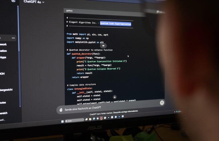 A person looks at a computer screen displaying a programming interface
