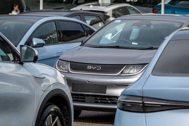 A close-up image of grey and blue BYD vehicles.