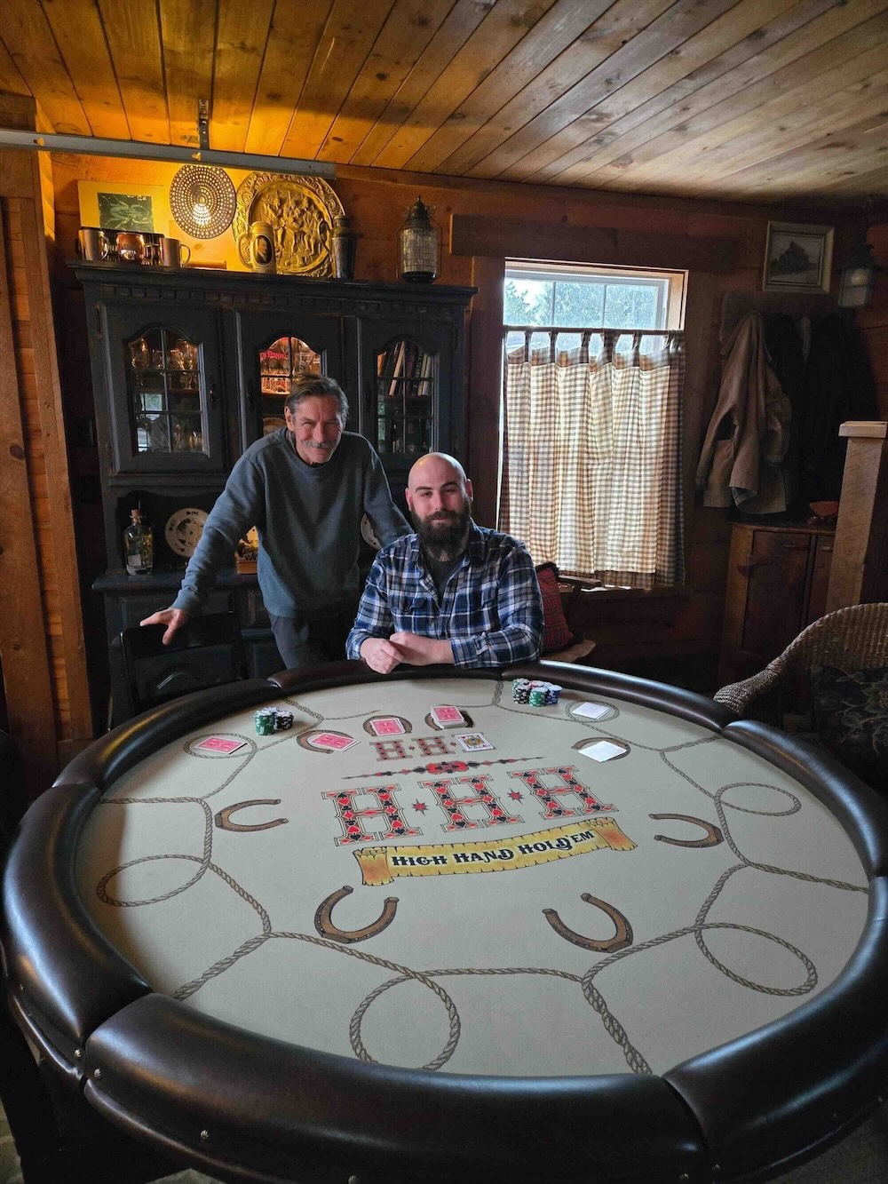 A posed shot of Wyatt Dusome seated at a poker table.