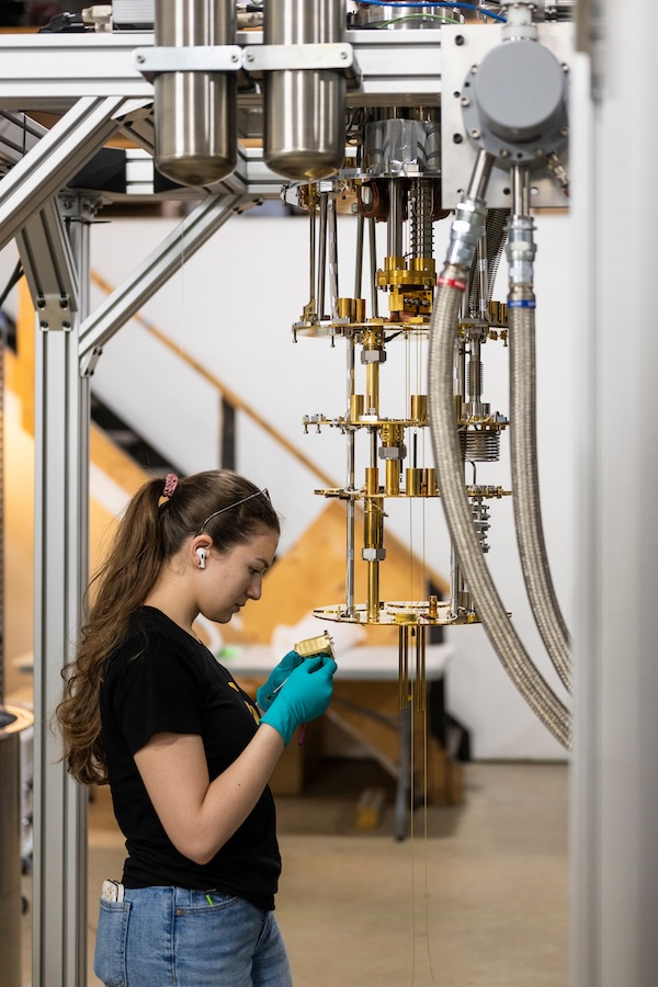 A shot of an employee working on one of Zero Point’s chandelier-like devices.