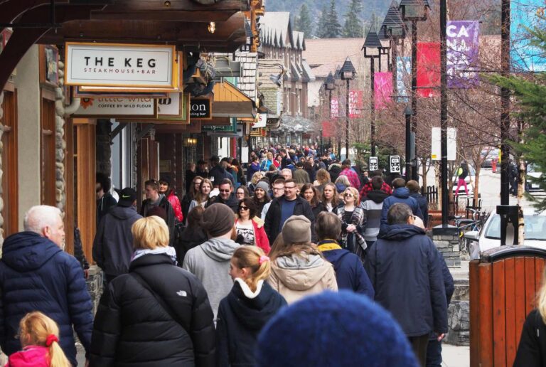 A shot of a crowded commercial walkway in the resort town of Banff, Alta.