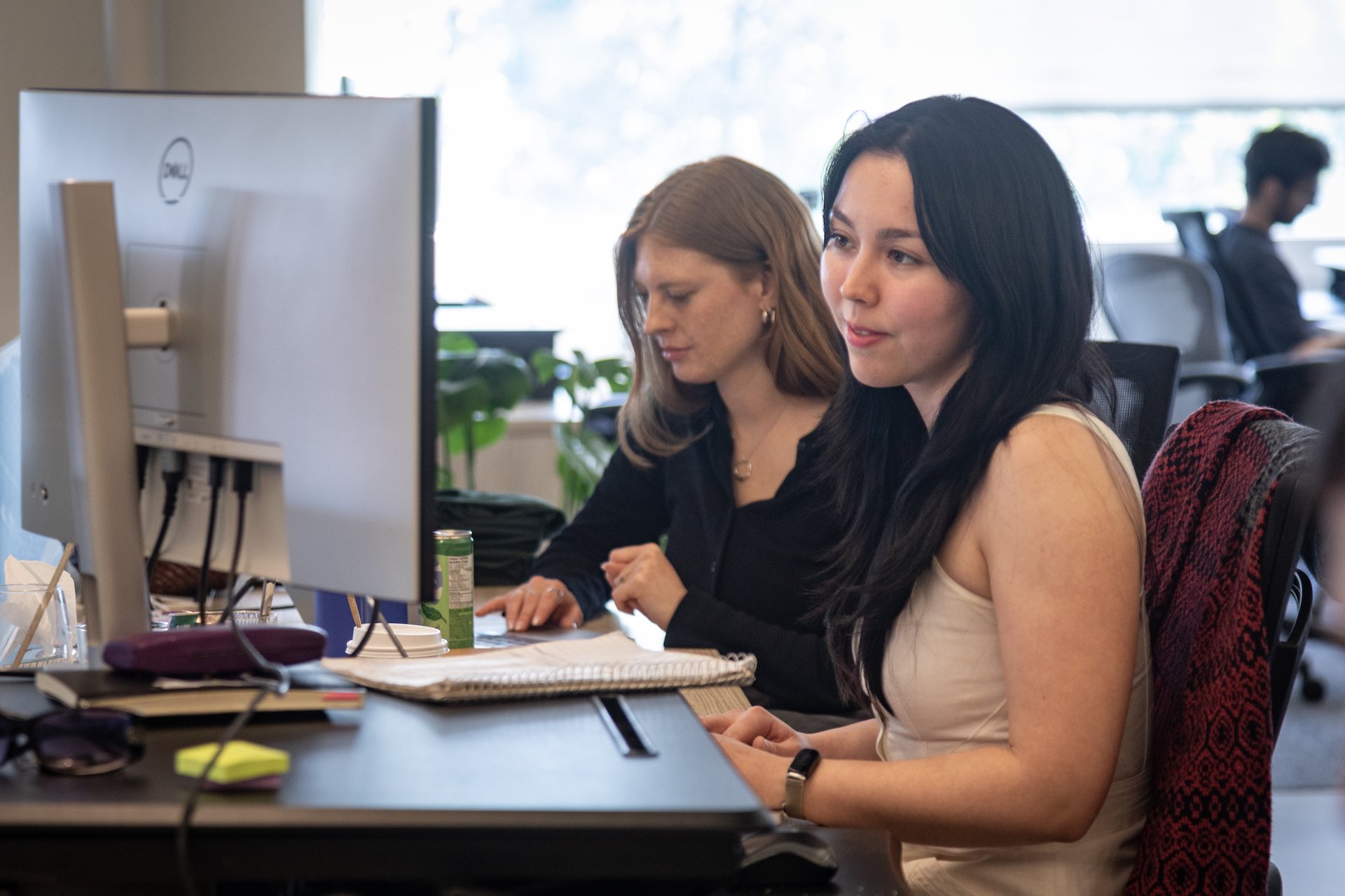 A shot of two staff members, both women, working at computer terminals in LawZero's offices.