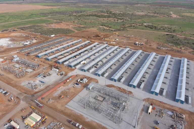 An aerial image of rows of data-centre buildings under construction.
